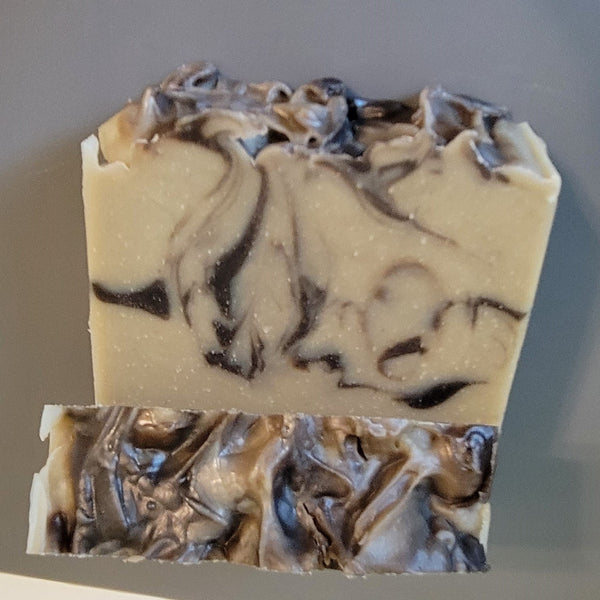 Goat milk soap with a base color of grayish green (Glacial Clay) and swirls of black (Brazilian Black Clay). Scented with Coriander and Salted Olive fragrance. This soap contains shea butter olive oil castor oil and cocoa butter.